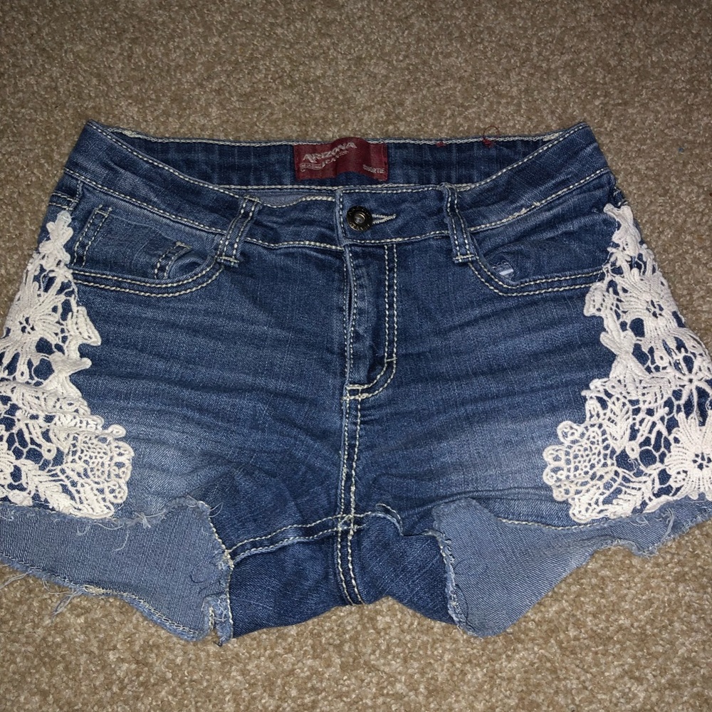 medium wash “Arizona Jean Co.” shorts.